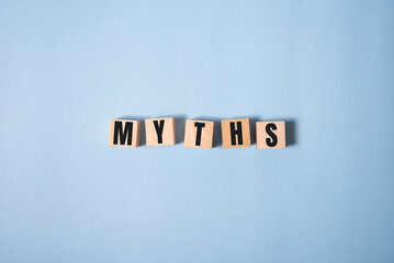 Myths word on wooden cubes. Myths concept on blue