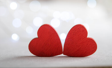 Festive hearts on a silver bokeh background