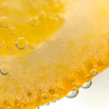 Orange slice bubbles in flovered water