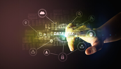 Hand touching DATA LEAK inscription, Cybersecurity concept