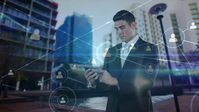 Animation of network of connections with people icons over businessman using smartphone