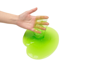 Green slime toy in woman hand isolated on white background.