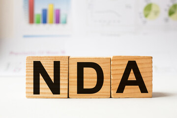 a word NDA on wooden cubes. business concept. business and Finance