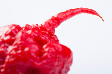 Carolina Reaper extra hot chilli paper on white background