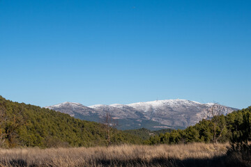 Mount Aitana with snow, on a sunny winter day.