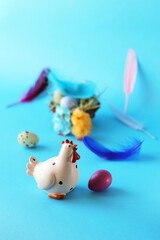 Easter eggs, chicken and decorations on a bright background, congratulations, postcard