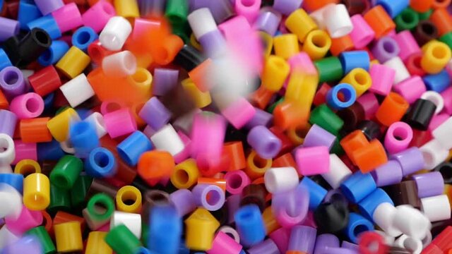 Colorful fusible plastic beads. Close up.