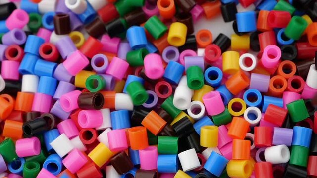Colorful fusible plastic beads. Close up.