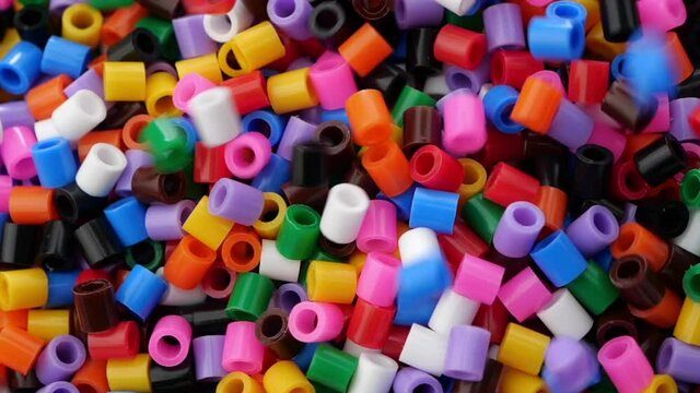 Colorful fusible plastic beads. Close up.