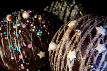chocolate balls with cocoa and marshmallows in New Year's decoration