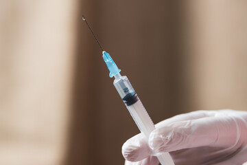 hand holding syringe