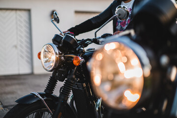 Person on motorcycle at sunset 