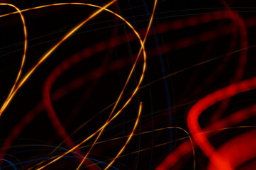 Fancy background - colored luminous irregular lines. Graphic background with neon luminous elements.