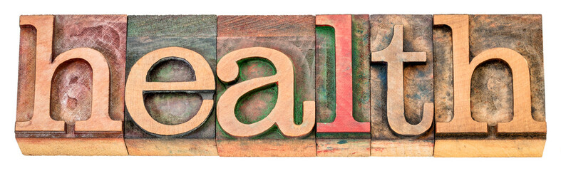 health - isolated word in letterpress wood type, wellness and well-being concept