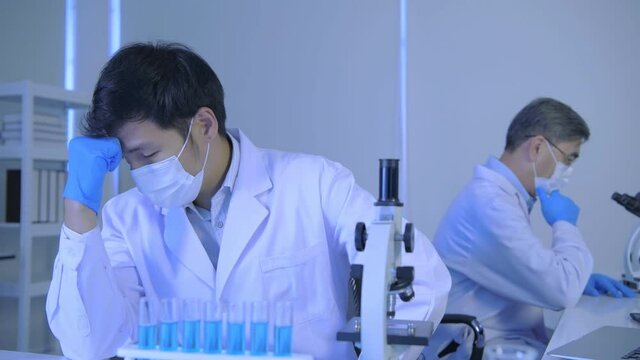 Research concept of 4k resolution. Scientists are stressed about laboratory research.