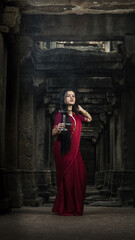 Beautiful indian girl dancer in the posture of Indian dance . Indian classical dance bharatanatyam....