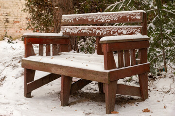  Snow-covered old bench.