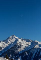 Plane trails on a clear blue sky in spring