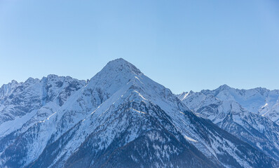 Mountain peaks textured and covered in melting snow - mountin ridges covered in snow