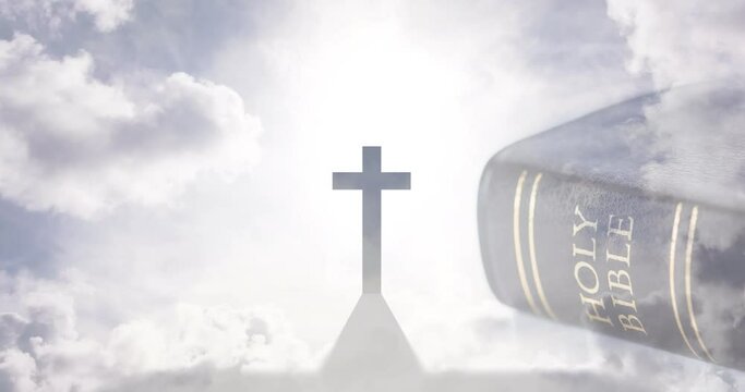 Animation of christian cross and holy bible with sun and clouds