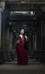 Beautiful indian girl dancer in the posture of Indian dance . Indian classical dance bharatanatyam....