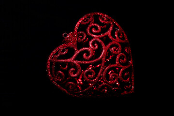 red decorative heart on black background