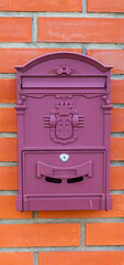 Mailbox on the brick wall of the house