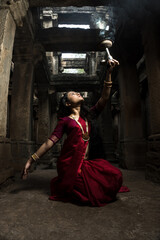 Beautiful indian girl dancer in the posture of Indian dance . Indian classical dance bharatanatyam....