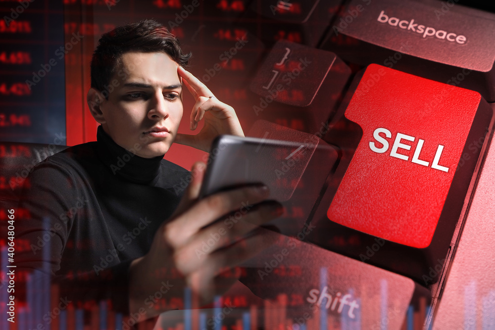 Aufkleber trader studies stock information against the background of a keyboard key with the inscription sell.