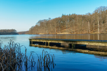 Fototapeta na wymiar Wooden landingstage at Huwenowsee lake in Meseberg