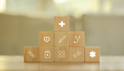 Medical concept health insurance on wooden block with healthcare medical icon