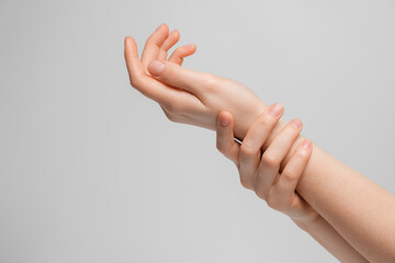 Women's hands get moist or show joint pain.