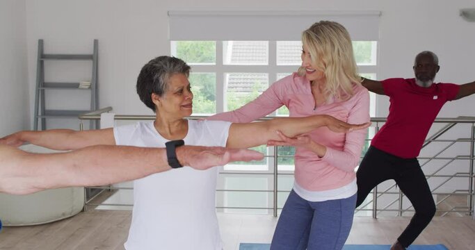 Diverse group of seniors taking part in fitness class
