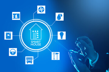 A person controls a smart home from a tablet. Mobile application for home automation. Modern home technologies. Internet of Smart things on a blue background.