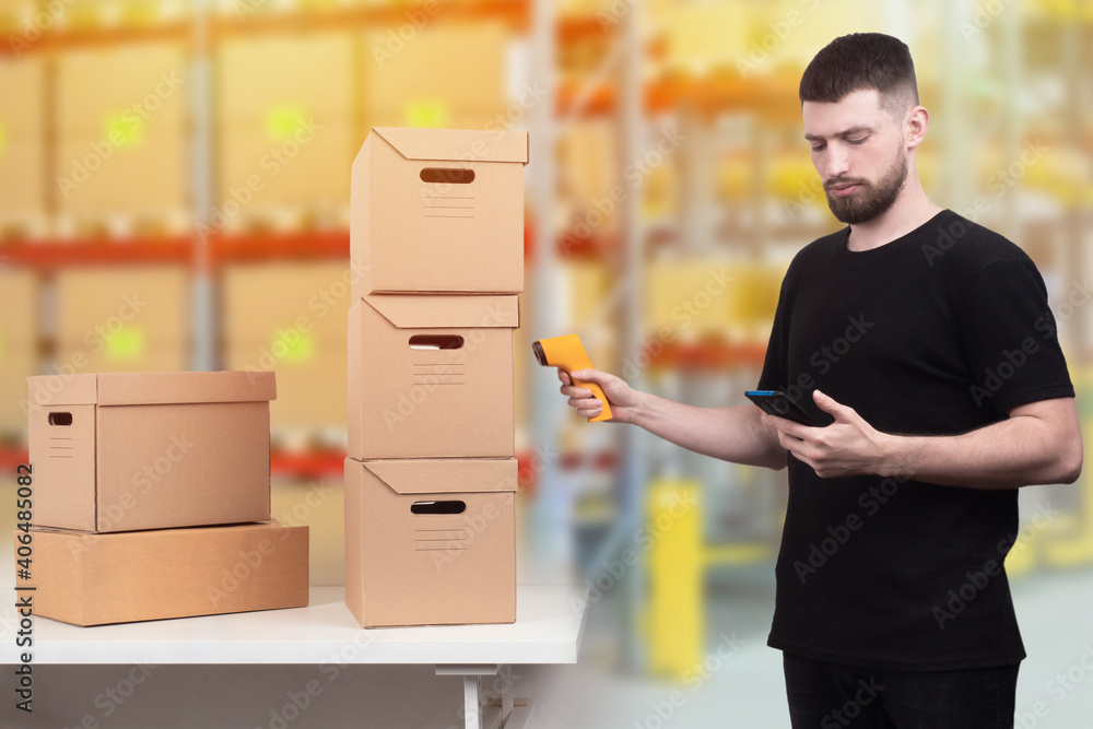Poster encoding of products. a man with a barcode reader and a smartphone. the storekeeper reads informatio