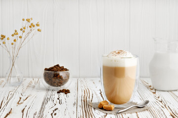 cup of cappuccino on table