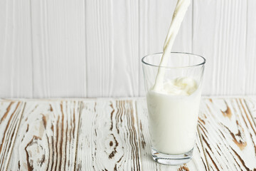 milk pouring into glass