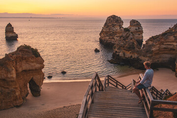 man during sunrise at Algarve, Portugal
