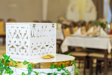 Vintage wedding gift box for money and greeting cards. Decoration details on wedding table. Vintage box for money at the wedding.