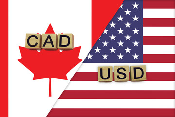 Canada and USA currencies codes on national flags background