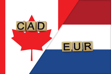 Canada and Netherlands currencies codes on national flags background