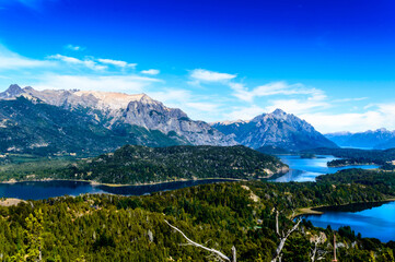 Lake in Bariloche in the summer of March. Sunny. Water, pine trees.