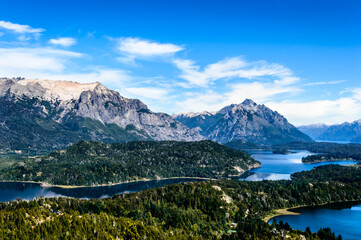 Lake in Bariloche in the summer of March. Sunny. Water and pine trees.