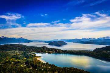 Lake in Bariloche in the summer of March. Sunny. Water and pine trees.