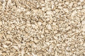 Abstract background of gravel, pebbles, shingle. Neutral colors. Black and white.