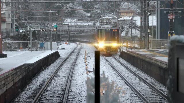 Biwako Line trains in Japan, Bound for Kyoto in Winter Snow