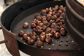 Many chestnuts being roasted for eating