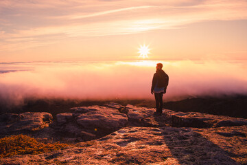 silhouette of a person on a top