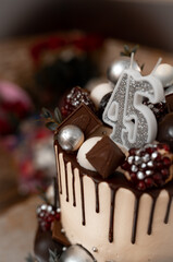 Burning candles in the form of 45 forty five figures (numbers, dates) for cake isolated on black background. The concept of celebrating a birthday, anniversary, important date, holiday, table setting