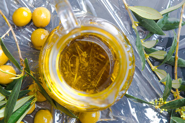 Extra virgin olive oil and olives fruits.